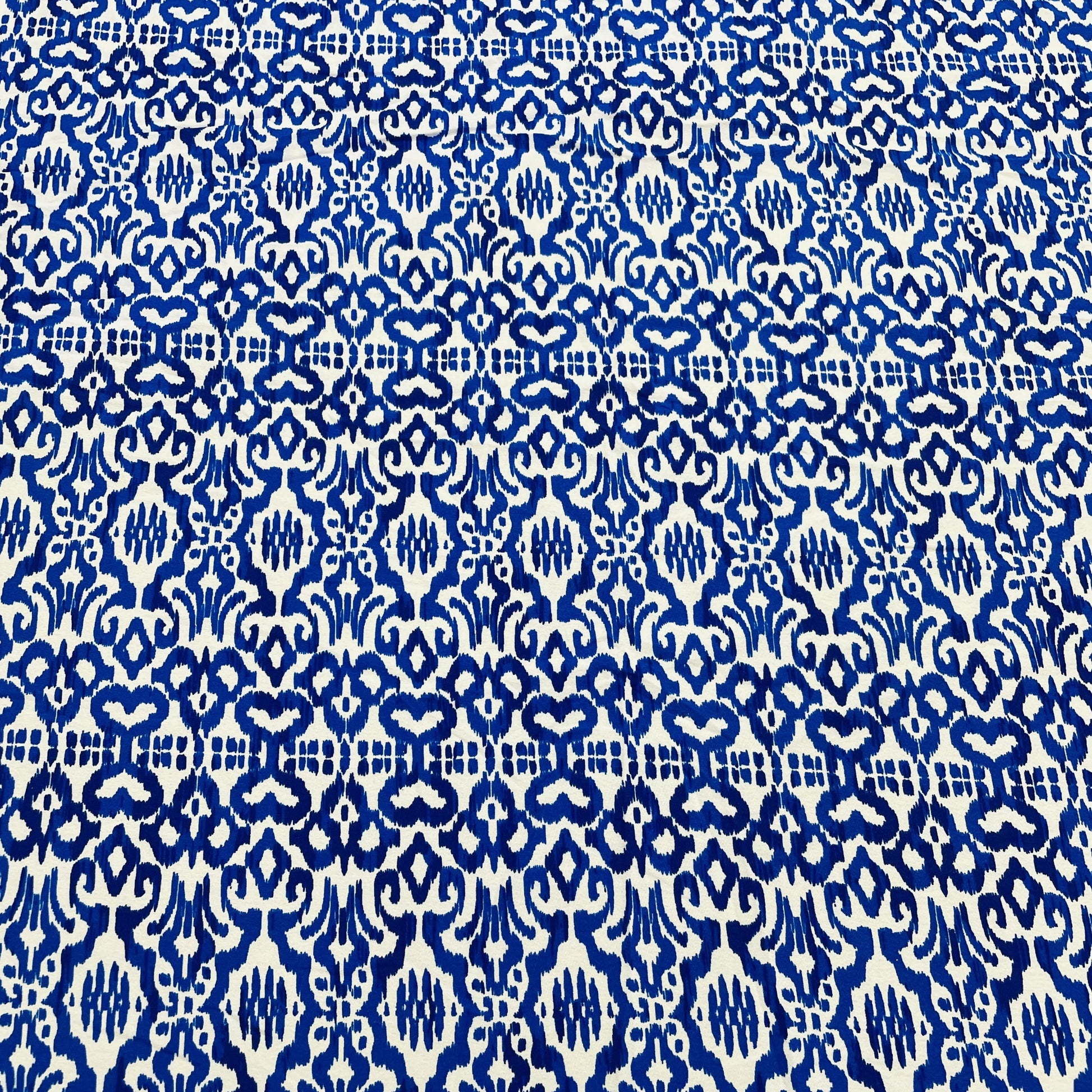 White & Blue Ikkat Print Crepe Fabric