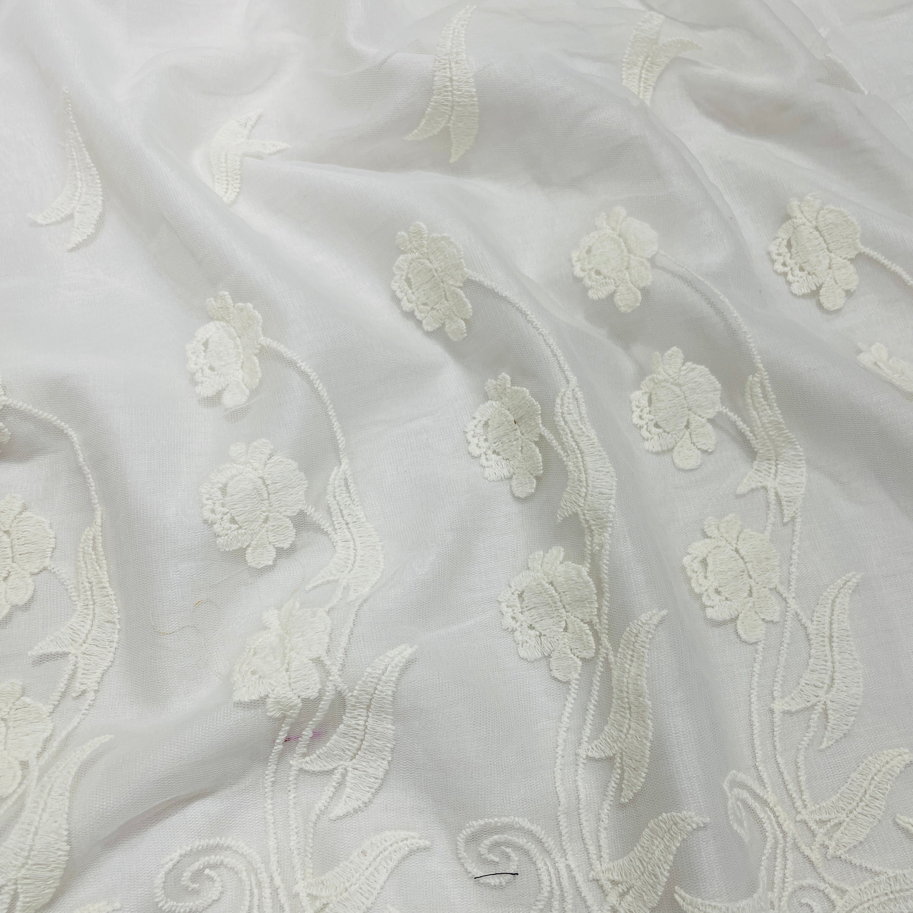 Embroidered net store lace fabric